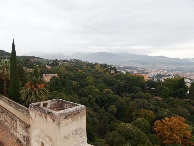 The snow-covered Sierra Nevada seen across Granada's rooftops from the Alhambra.