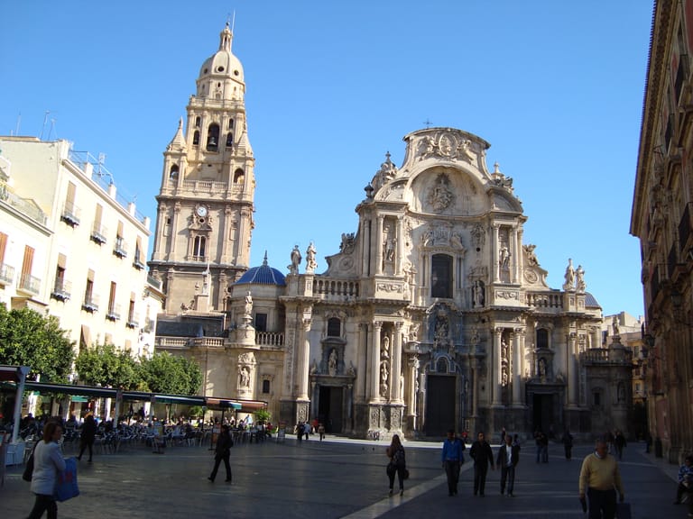 The cathedral front and the bishop's palace across the Plaza del Cardenal Belluga in Murcia.
